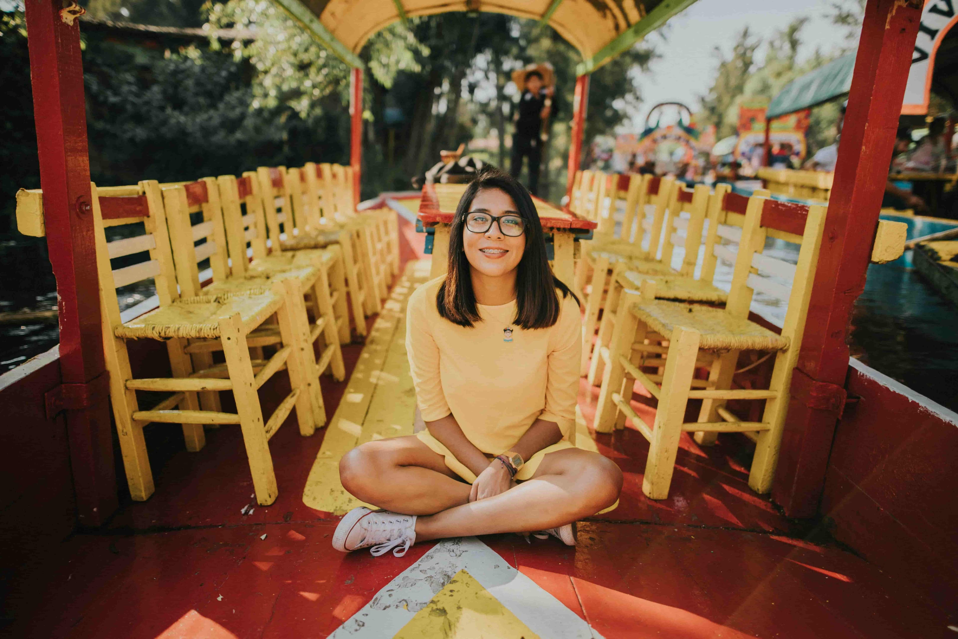 Person wearing blue-light-filtering glasses outdoors