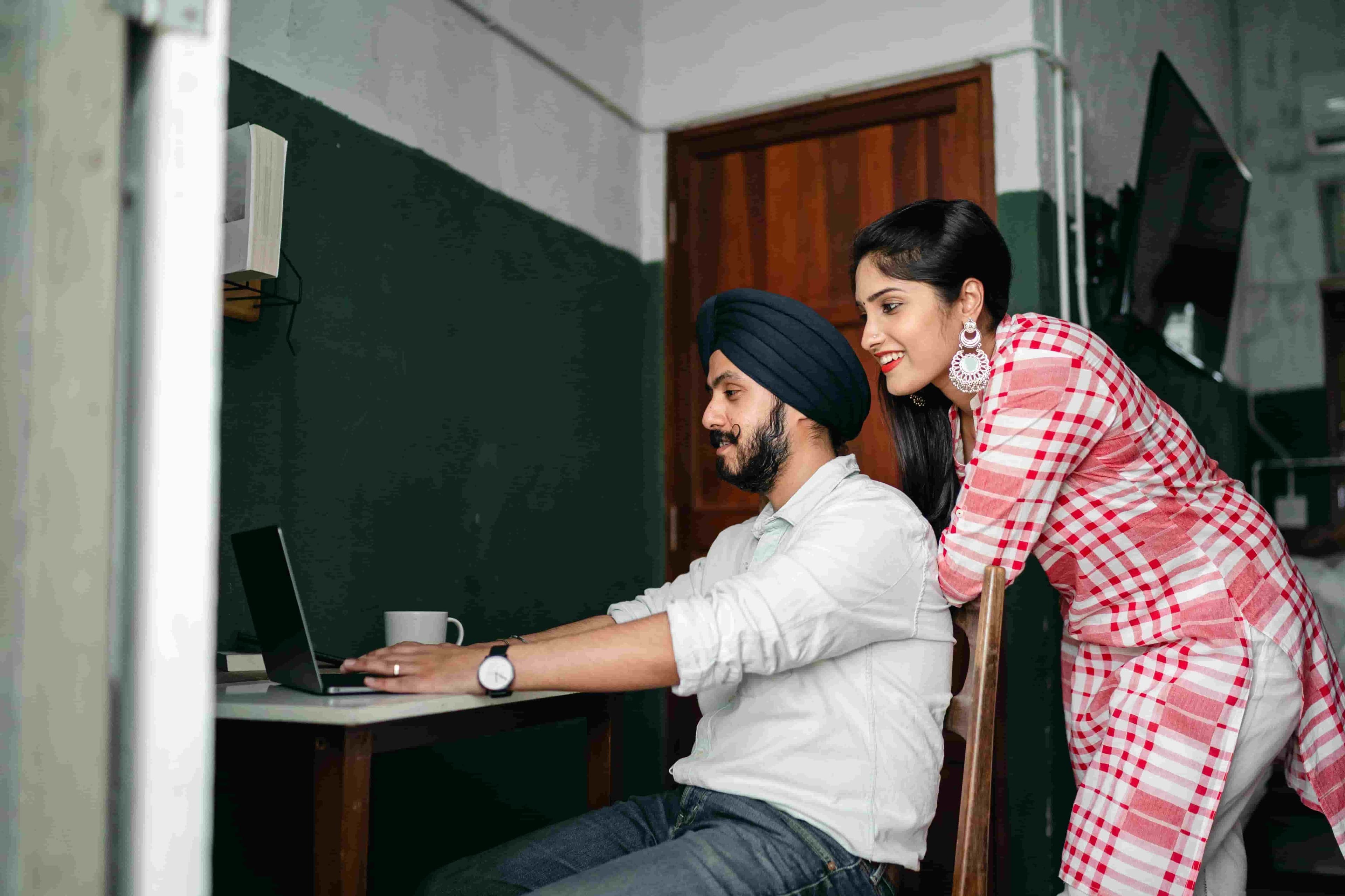 Couple working from home in the UK