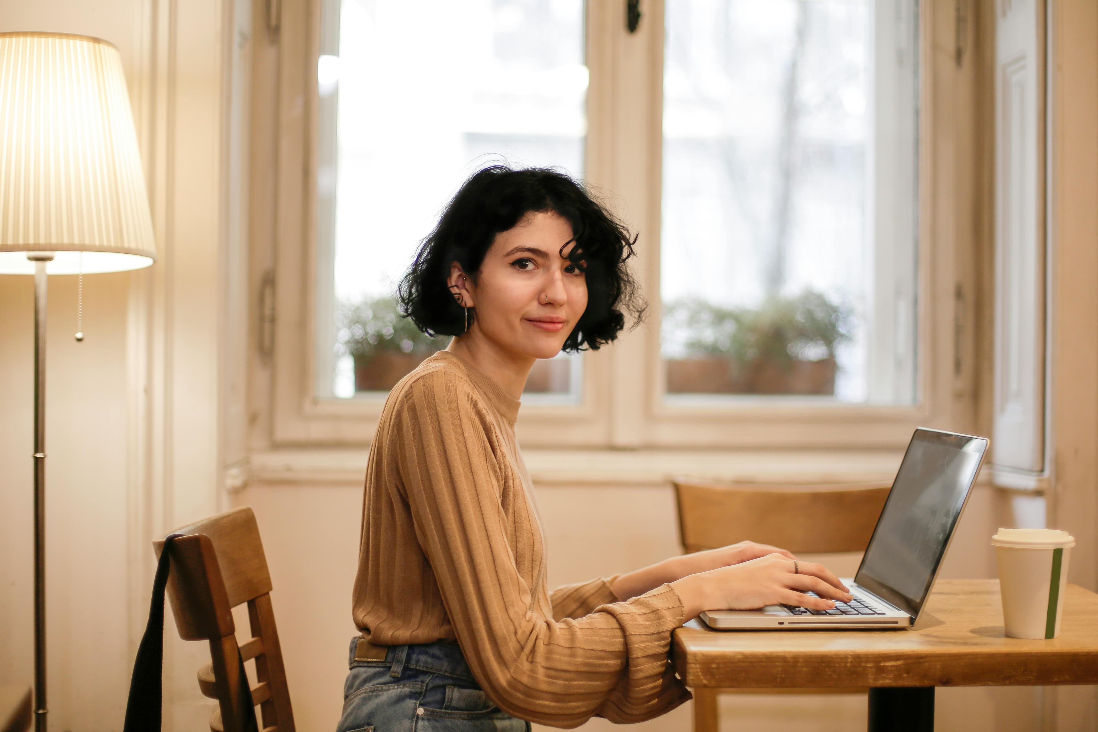 Woman smiling from computer